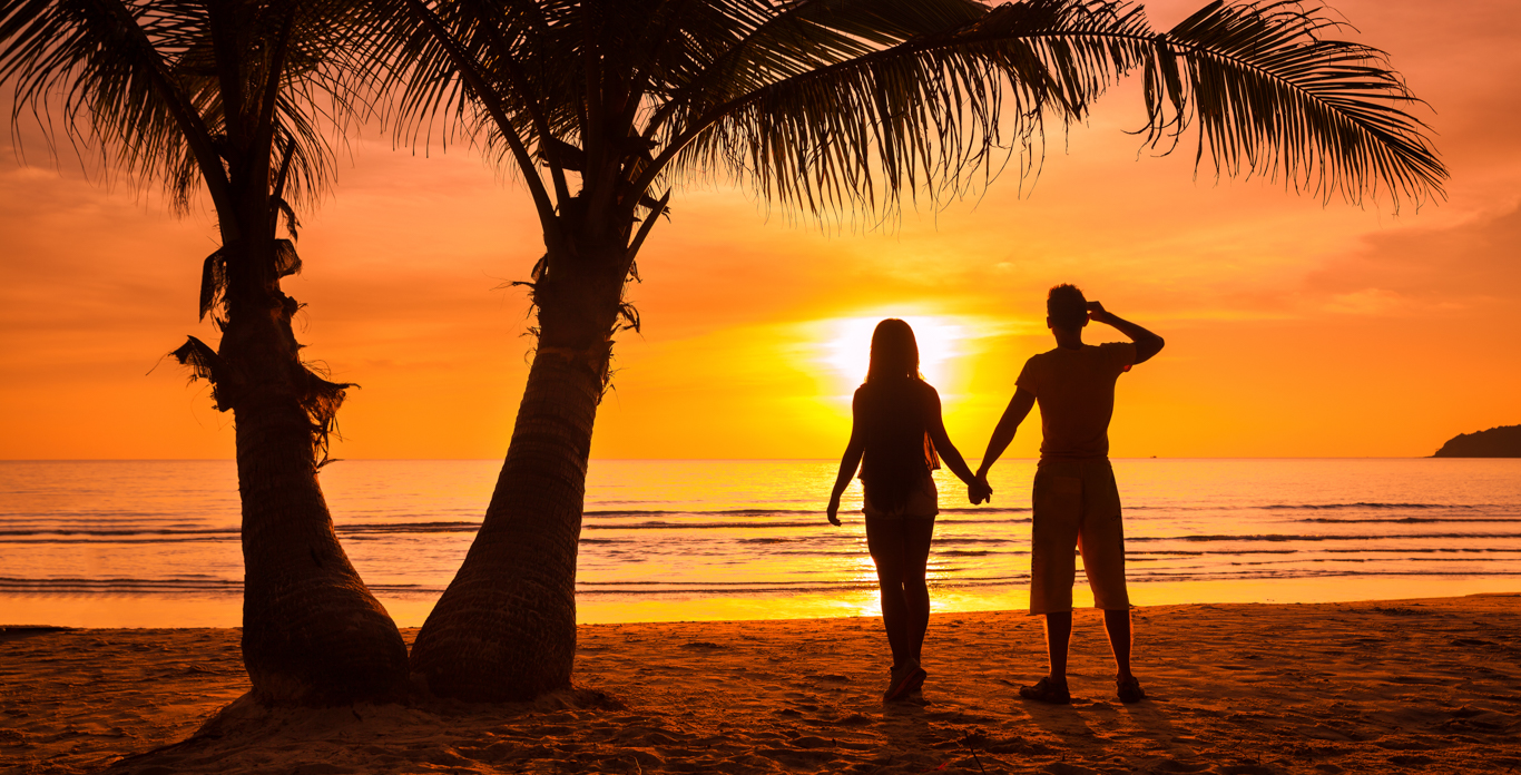 Top 5 Private Luxury All-Inclusive Caribbean Honeymoon Yacht Charters Honeymoon Couple on a Typical Beach on a Caribbean Honeymoon Private Yacht Charter