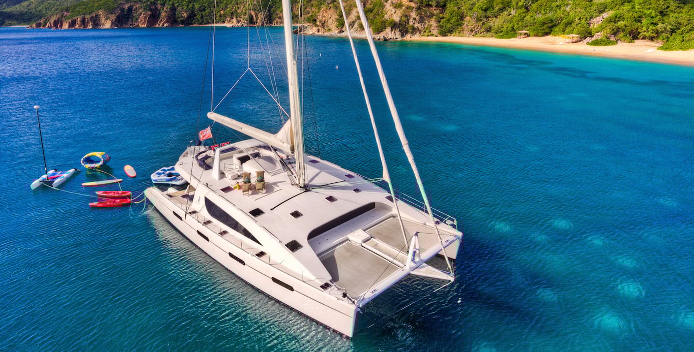 Catamaran Zingara on Caribbean Yacht Charter specials anchored in a private cove.