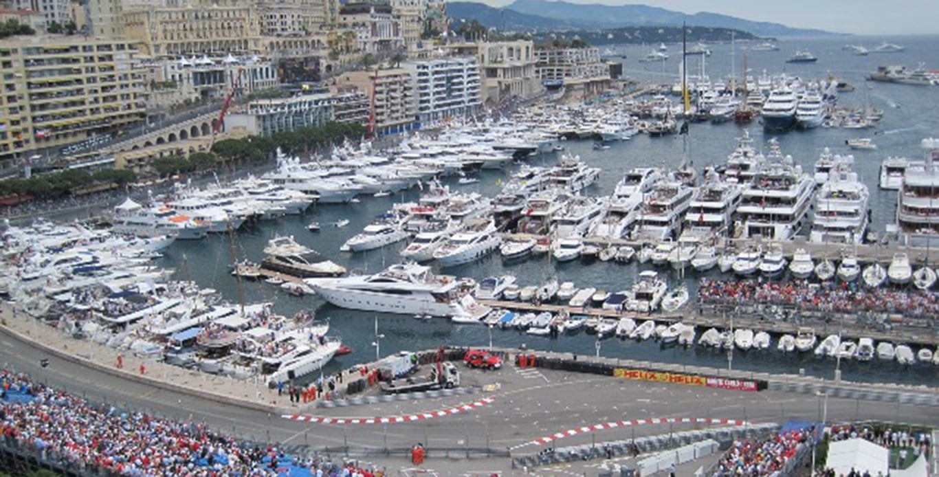 Arial view of the Monaco Grand Prix race track with super Yacht Charters anchored in the harbor.