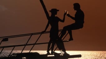 couples toasting sunset on BVI sailing vacation