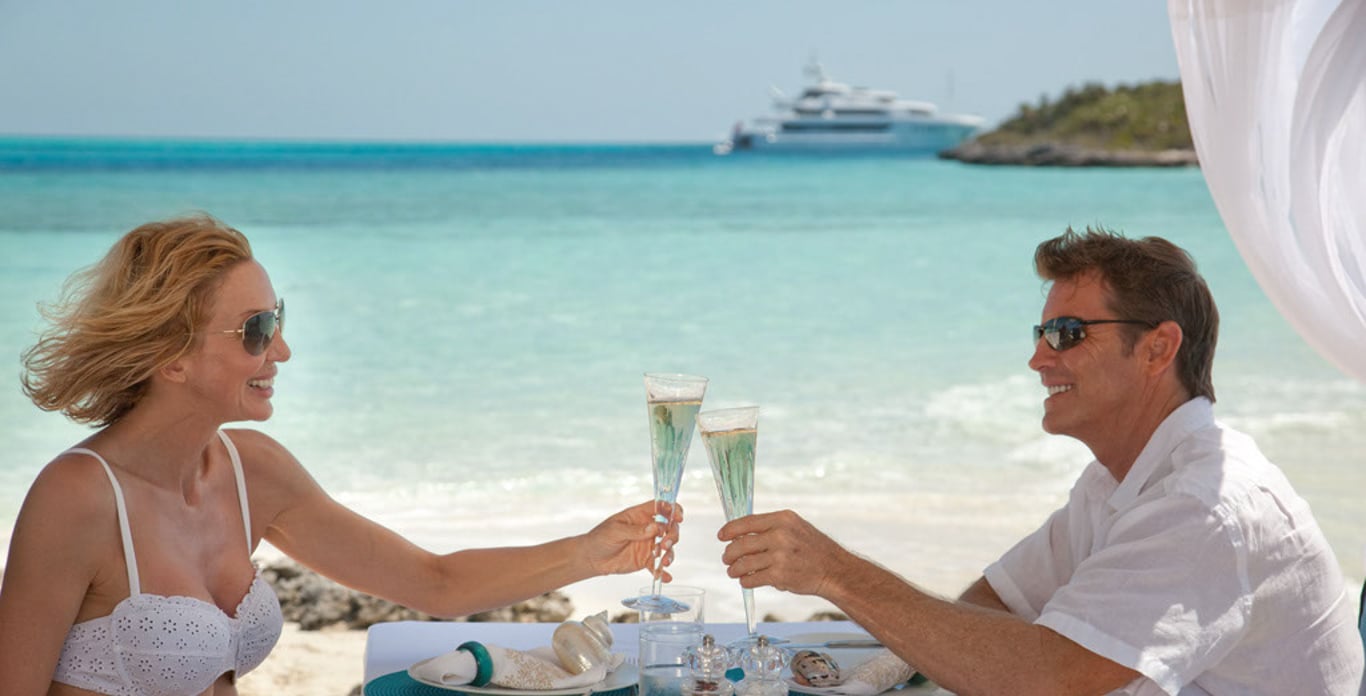 couple toasting off theie yacht in the BVI