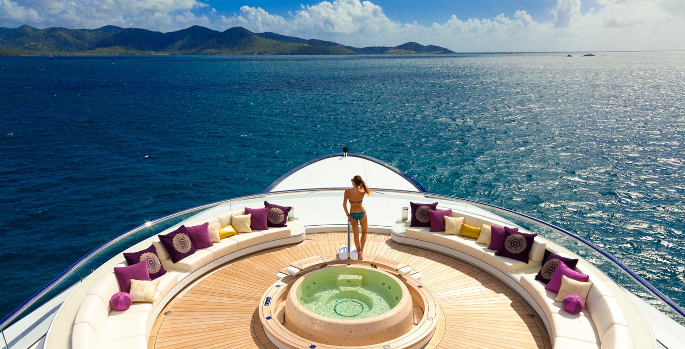 woman on bow of superyacht