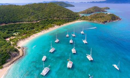 yachts anchored off a resort in the BVI
