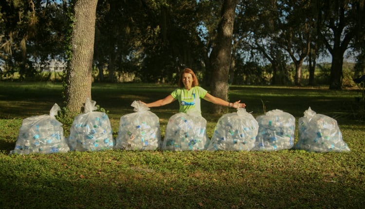 yacht charter broker Trish Cronan with Plastic water bottle trash