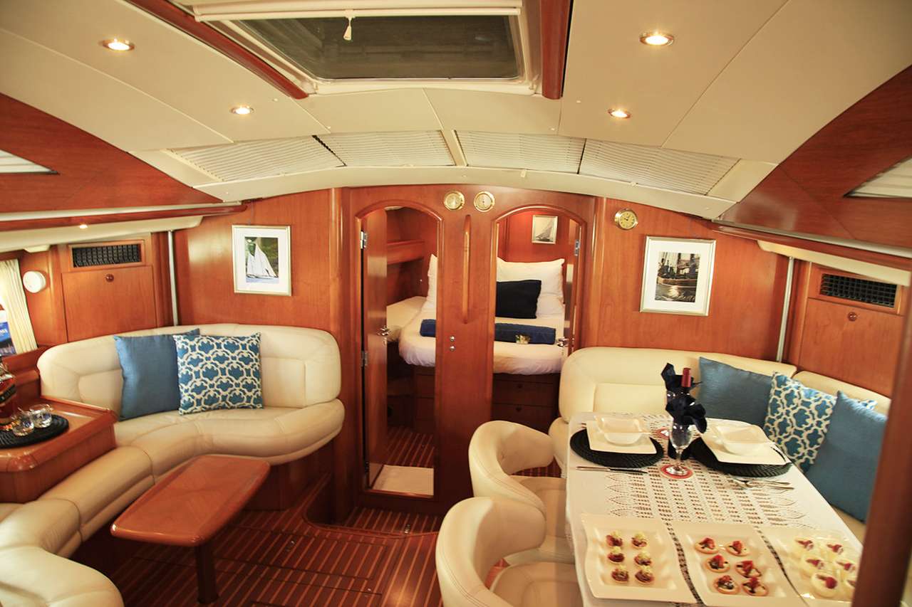 Sailing Yacht 'SAYANG' Saloon lounging area with some snacks!, 4 PAX, 2 Crew, 55.00 Ft, 16.00 Meters, Built 2005, Jeanneau, Refit Year Constantly