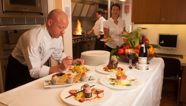 Crewed yacht Charter chef preparing dinner