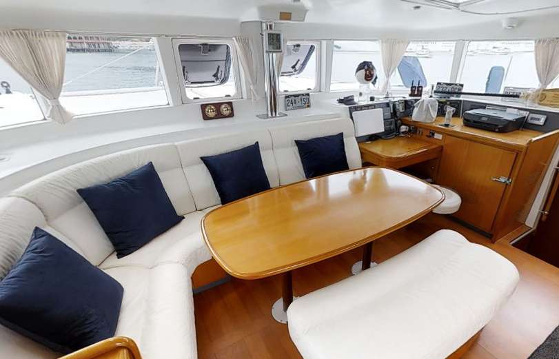 Catamaran Yacht 'ALTITUDE ADJUSTMENT' Salon &amp;  Interior Dining, 6 PAX, 1 Crew, 44.00 Ft, 13.00 Meters, Built 2007, Lagoon, Refit Year 2014/2021 - New hard top over the fly bridge and new name graphics