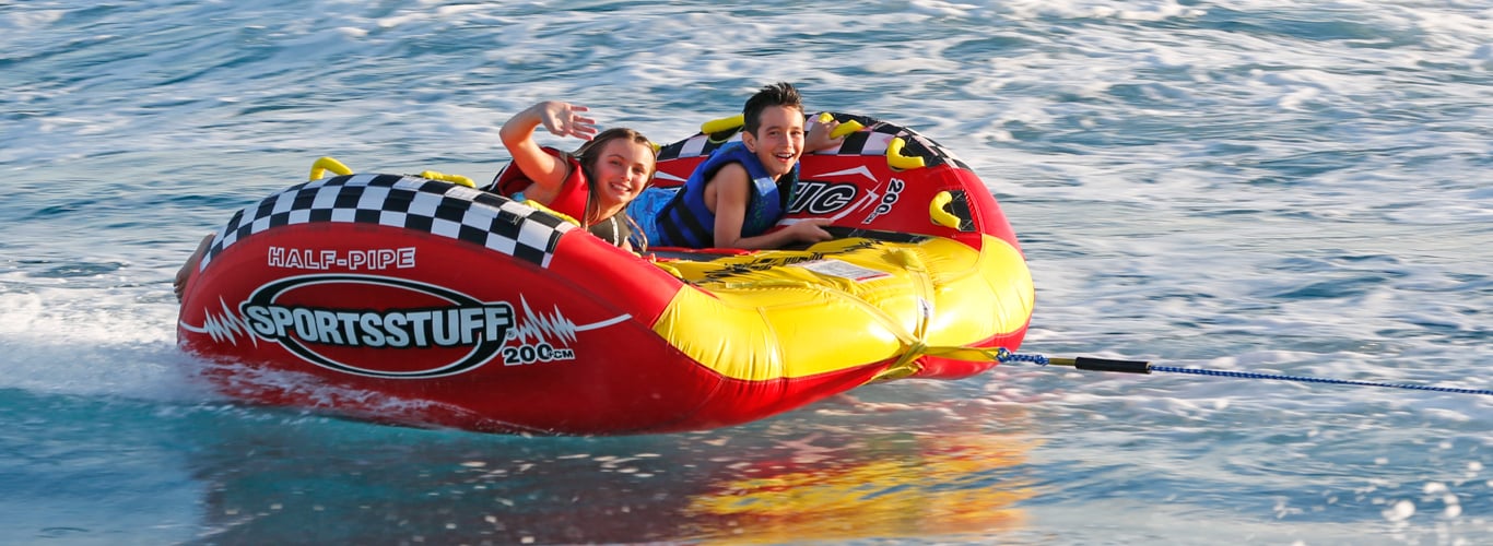 Kids tubing on a BVI catamaran charter