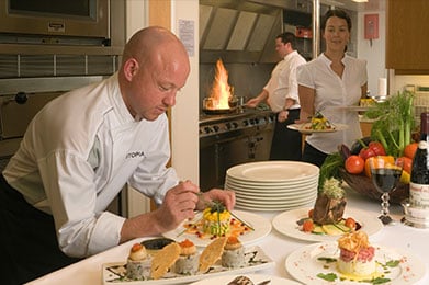 Chef preparing meal on charter yacht
