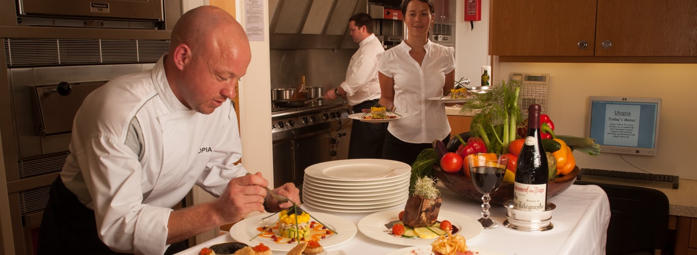 Superyacht chef preparing meals for charter guests