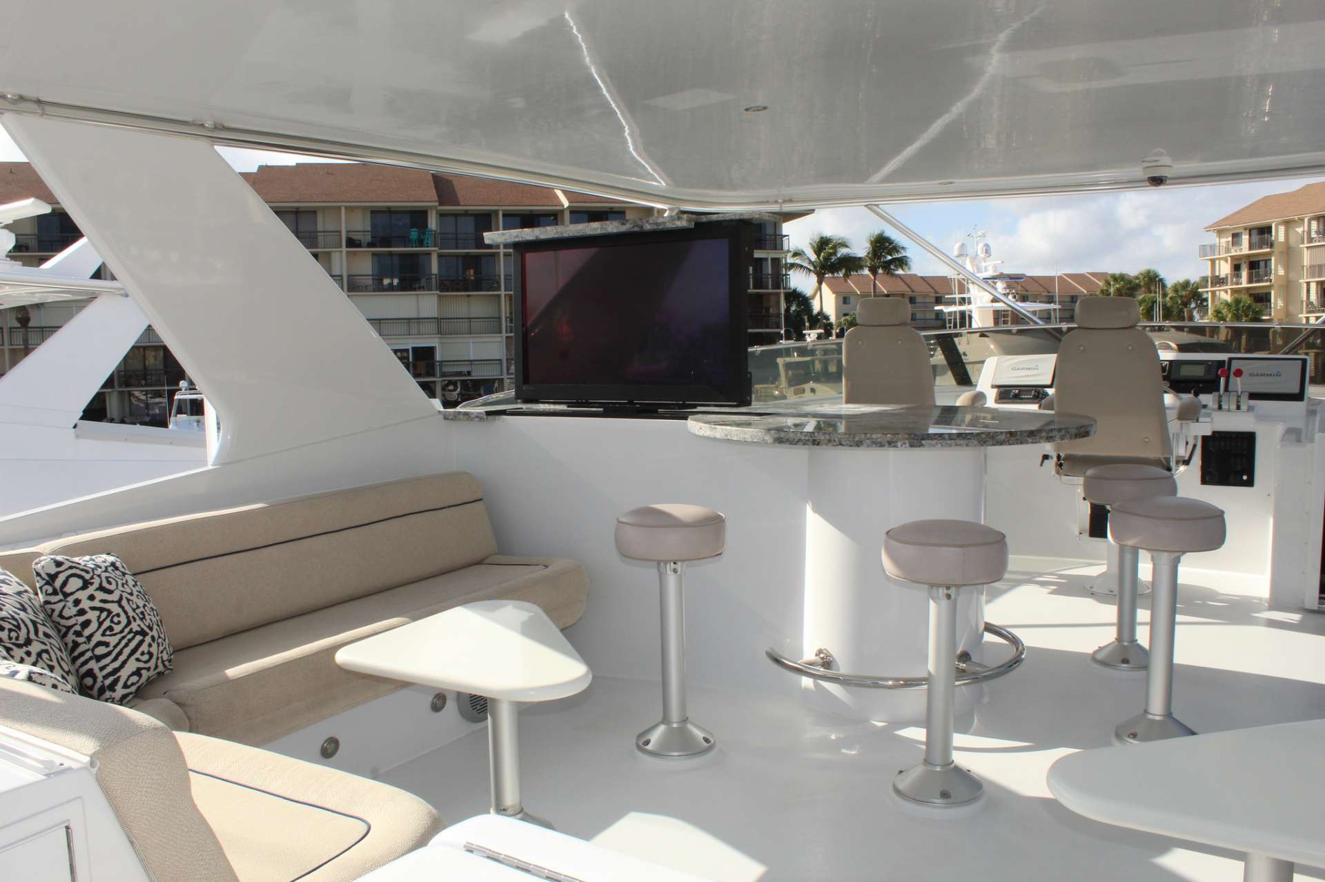 Motor Yacht 'ISLAND GIRL' Aft cockpit dining table, 6 PAX, 2 Crew, 75.00 Ft, 22.00 Meters, Built 2002, Hatteras, Refit Year 2018