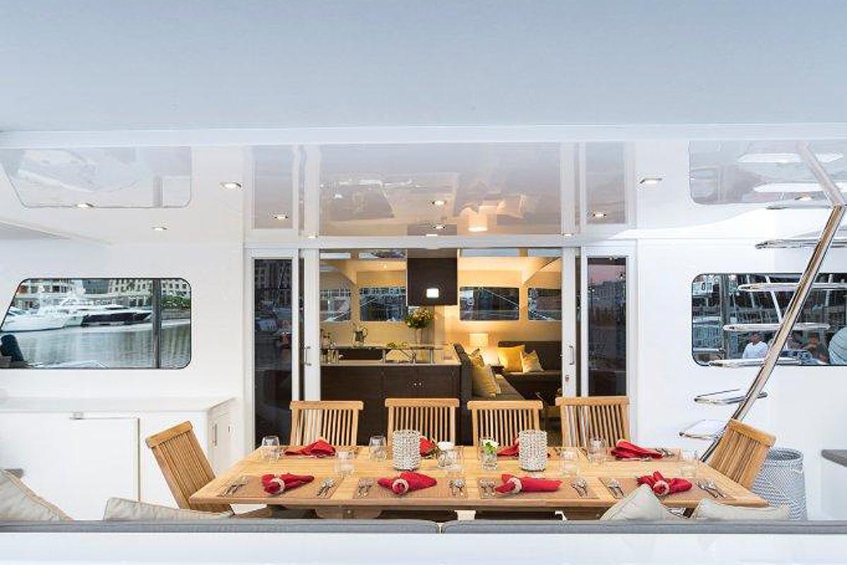 Catamaran Yacht 'TRANQUILITY' Stern cockpit dining area, 12 PAX, 4 Crew, 76.00 Ft, 23.00 Meters, Built 2014, Matrix Yachts