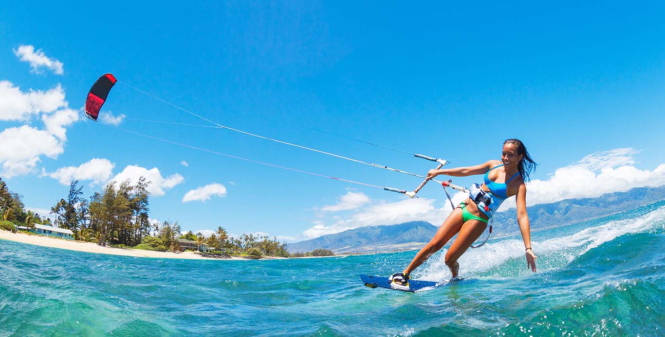 Luxury Kitesurfing Holidays Woman enjoying kitesurfing on a Luxury kitesurfing holidays